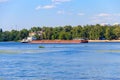 Heavy long barge sailing on the Dnieper river in Kiev, Ukraine