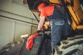 Heavy Machinery Mechanic Performing Tractor Maintenance Royalty Free Stock Photo