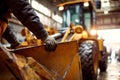 Heavy machinery operator preparing equipment inside a construction warehouse during daylight hours Royalty Free Stock Photo