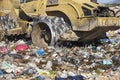 Heavy machinery shredding garbage in an open air landfill. Pollution management Royalty Free Stock Photo