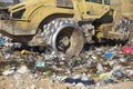 Heavy machinery shredding garbage in an open air landfill. Pollution management Royalty Free Stock Photo