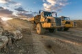 Large trucks in an open pit mine