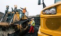 Heavy machinery and workers in pit of quarry Royalty Free Stock Photo