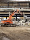 Heavy machinery works at the plant for the processing of reinforced concrete scrap. Royalty Free Stock Photo