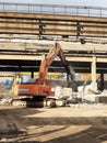 Heavy machinery works at the plant for the processing of reinforced concrete scrap. Royalty Free Stock Photo