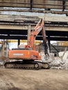 Heavy machinery works at the plant for the processing of reinforced concrete scrap. Royalty Free Stock Photo