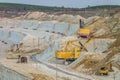 Heavy mining excavators in the chalky quarry