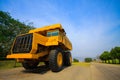 Heavy mining truck in mine and driving along the opencast. Photo of the big mine truck, The career heavy-load super car Royalty Free Stock Photo