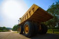 Heavy mining truck in mine and driving along the opencast. Photo of the big mine truck, The career heavy-load super car Royalty Free Stock Photo