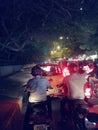 Heavy raffic in night bikers wearing helmet