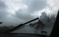 Heavy rain on a highway. Thunderstorm while driving a car Royalty Free Stock Photo