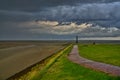 Heavy rain out of an impressive dark grey cloud in Fedderwardersiel, Germany Royalty Free Stock Photo