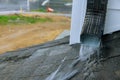 Heavy rain during the rainy season causing with water during heavy rain to flow down the roof Royalty Free Stock Photo