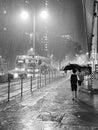 Hong Kong people walking on slippery road with umbrellas during heavy rain