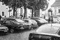 Heavy raindrops splashing on Vilnius Old Town. Black and White.