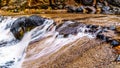 After heavy rainfall, water from Oak Creek flooding the road crossing Oak Creek at Orchard Canyon between Sedona and Flagstaff Royalty Free Stock Photo