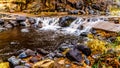 After heavy rainfall, water from Oak Creek flooding the road crossing Oak Creek at Orchard Canyon between Sedona and Flagstaff Royalty Free Stock Photo