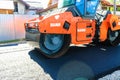 Heavy road roller on the roadway. Construction of a new road with support from the European Union structural funds. Targoviste,