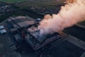 Heavy smoke in burning industrial warehouse or storehouse industrial hangar from burned roof, aerial view of fire disaster