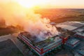 Heavy smoke in burning industrial warehouse or storehouse industrial hangar from burned roof, aerial view of fire disaster Royalty Free Stock Photo