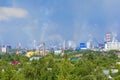 Heavy smoke industrial chimneys causing air pollution problems. Emissions are visible over residential areas of the city. Royalty Free Stock Photo