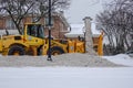 Heavy snogo blower truck clearing the snow from streets after a snowstorm in Montreal 2020