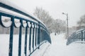 The railing of the bridge by a cap of snow. Royalty Free Stock Photo
