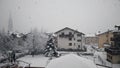 Heavy snow falling in little italian village Pinzolo trentino alto adige Italy