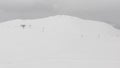 Heavy snowfall in caucasus top mountain Ski resort Goderdzi. High Adjara. Skiers and ski lifts in stormy winter weather