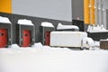 Heavy snowfall. Delivery of goods to the warehouse logistics complex is complicated Royalty Free Stock Photo