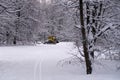 14.12.2021. Heavy snowfall in Moscow. Snowcat ratrak rides up the hill and preparation ski slope