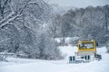 14.12.2021. Heavy snowfall in Moscow. Snowcat ratrak rides up the hill and preparation ski slope