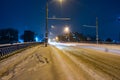 Snowbound city street at night