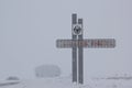 TYUMEN OBLAST, RUSSIA - JANUARY 13, 2017:Heavy snowfall. Road sign on the border of Kurgan region and Tyumen region. The inscripti