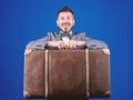 Heavy suitcase. Delivery service. Travel and baggage concept. Hipster traveler with baggage. Baggage insurance. Man well Royalty Free Stock Photo