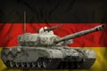 Heavy tank with city pixel camouflage on the Germany national flag background. 3d Illustration