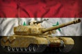 Heavy tank with desert camouflage on the Syrian Arab Republic national flag background. 3d Illustration