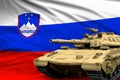 Heavy tank with fictional design on Slovenia flag background - modern tank army forces concept, military 3D Illustration