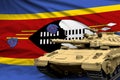 Heavy tank with fictional design on Swaziland flag background - modern tank army forces concept, military 3D Illustration