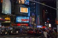 Heavy traffic and illuminated billboard ads at night at Times Square, New York City Royalty Free Stock Photo