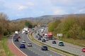 Heavy traffic three lane motorway in countryside Royalty Free Stock Photo