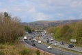 Heavy traffic three lane motorway in countryside Royalty Free Stock Photo