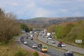 Heavy traffic three lane motorway in countryside Royalty Free Stock Photo