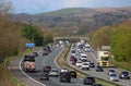 Heavy traffic three lane motorway in countryside Royalty Free Stock Photo