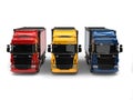 Heavy transport trucks - red, blue and yellow - front view