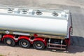 Heavy transportation industry. Moving liquid shipment. Tank trailer semi truck on a parking, aerial view.