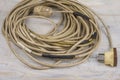 Heavy used  repaired extention cable on a wood Royalty Free Stock Photo