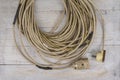 Heavy used  repaired extention cable on a wood Royalty Free Stock Photo