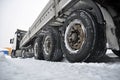 Heavy vehicle stuck in the snow on the road. Skidding