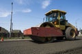 Heavy Vibration roller at asphalt pavement working on the new road construction site. Repairing.